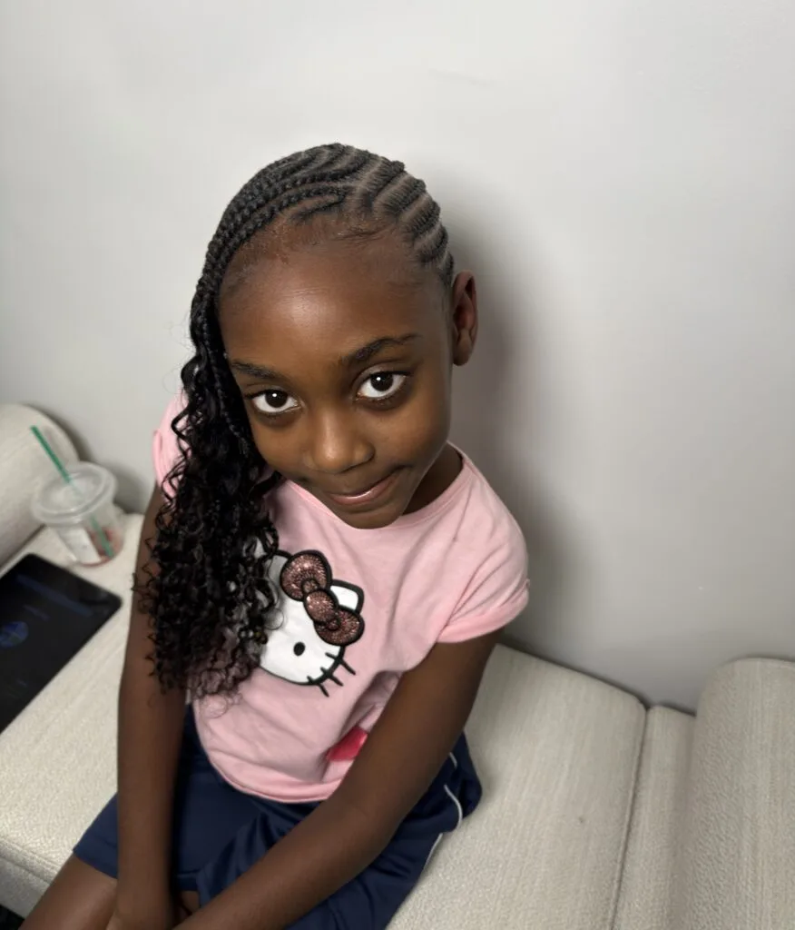 Young client at Nerielle Braiding Studio, front portrait