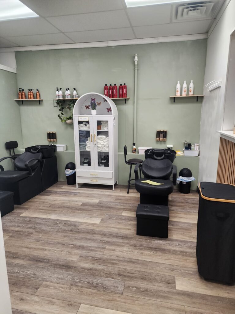Salon wash station with shampoo bowl chairs at Nerielle Braiding Studio